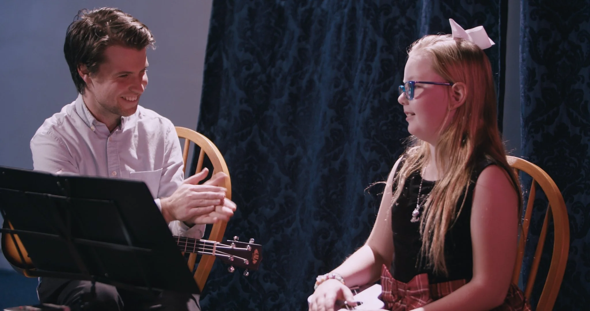 Liam Britten teaching a music lesson